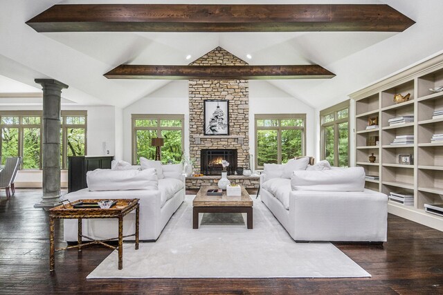 4850 Catamount Trl NE, Ada, MI 49301 - living room with wood-type flooring, plenty of natural light, ornate columns, and a fireplace