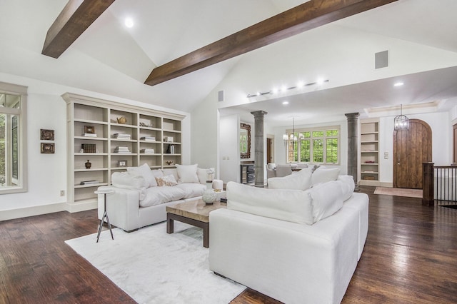 4850 Catamount Trl NE, Ada, MI 49301 - living room featuring decorative columns, beam ceiling, a chandelier, wood finished floors, and built in features
