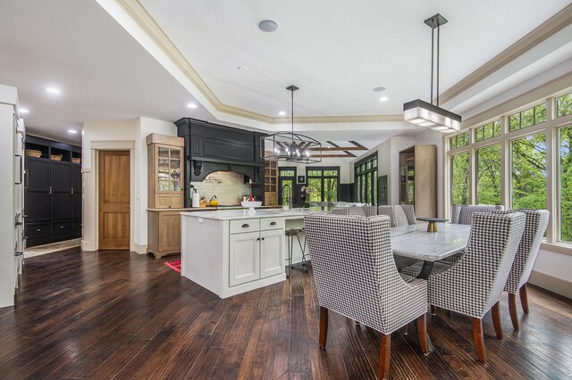 4850 Catamount Trl NE, Ada, MI 49301 - dining area featuring plenty of natural light, ornamental molding, dark wood-type flooring, a raised ceiling, and recessed lighting