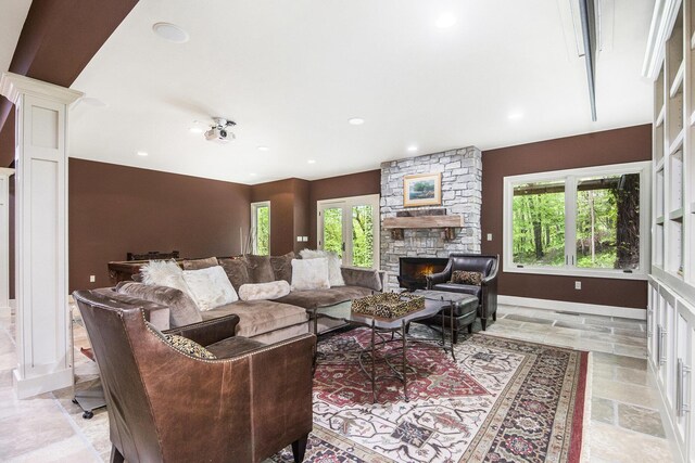 4850 Catamount Trl NE, Ada, MI 49301 - living room featuring a fireplace, baseboards, and recessed lighting