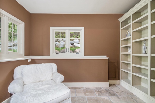 4850 Catamount Trl NE, Ada, MI 49301 - sitting room featuring baseboards and stone tile floors