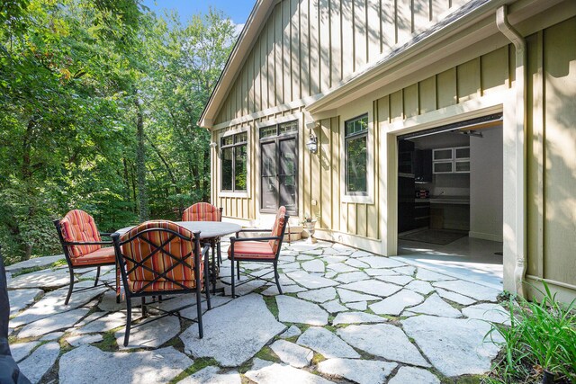 4850 Catamount Trl NE, Ada, MI 49301 - view of patio / terrace featuring outdoor dining area