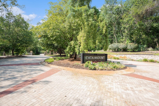 4850 Catamount Trl NE, Ada, MI 49301 - community sign with curved driveway