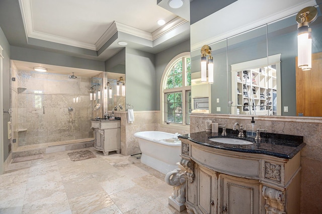4850 Catamount Trl NE, Ada, MI 49301 - bathroom with tile walls, ornamental molding, a stall shower, two vanities, and a soaking tub