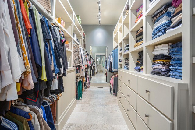 4850 Catamount Trl NE, Ada, MI 49301 - walk in closet with light stone finish flooring