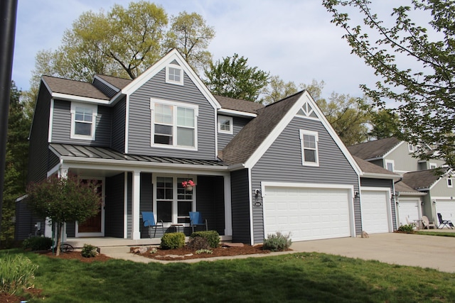 16894 Arbor Way Dr, Nunica, MI 49448 - traditional-style home featuring a porch, a standing seam roof, driveway, metal roof, and a front yard