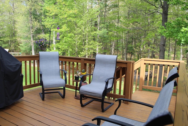 16894 Arbor Way Dr, Nunica, MI 49448 - wooden deck featuring a view of trees and area for grilling