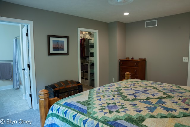 16894 Arbor Way Dr, Nunica, MI 49448 - bedroom featuring a spacious closet, a closet, recessed lighting, connected bathroom, and tile patterned floors