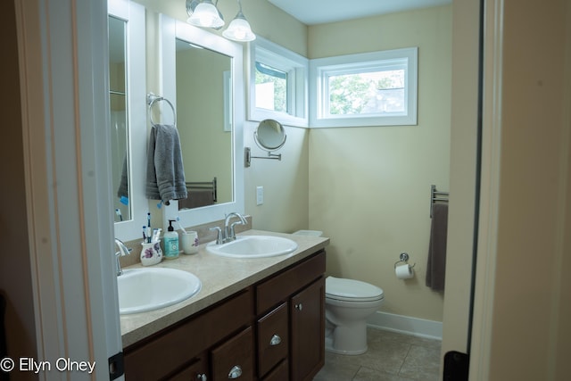 16894 Arbor Way Dr, Nunica, MI 49448 - full bath with toilet, tile patterned flooring, double vanity, and baseboards