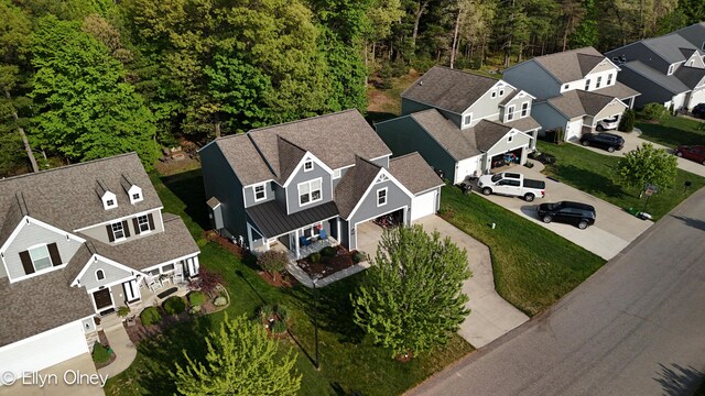 16894 Arbor Way Dr, Nunica, MI 49448 - aerial view of residential area with a heavily wooded area
