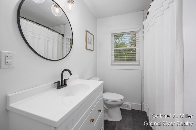 full bathroom featuring vanity, toilet, and tile patterned floors