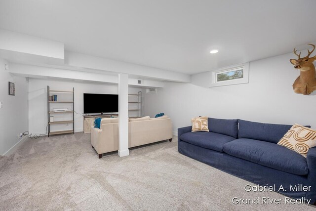 living room with carpet floors, recessed lighting, and baseboards