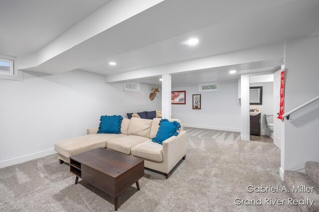 living room with carpet flooring, recessed lighting, and baseboards
