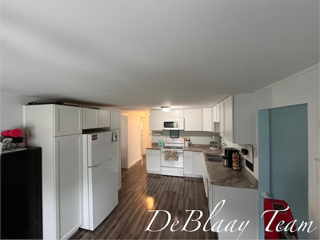 6061 Cutler Rd, Lakeview, MI 48850 - kitchen featuring white appliances, white cabinetry, dark wood finished floors, and a sink