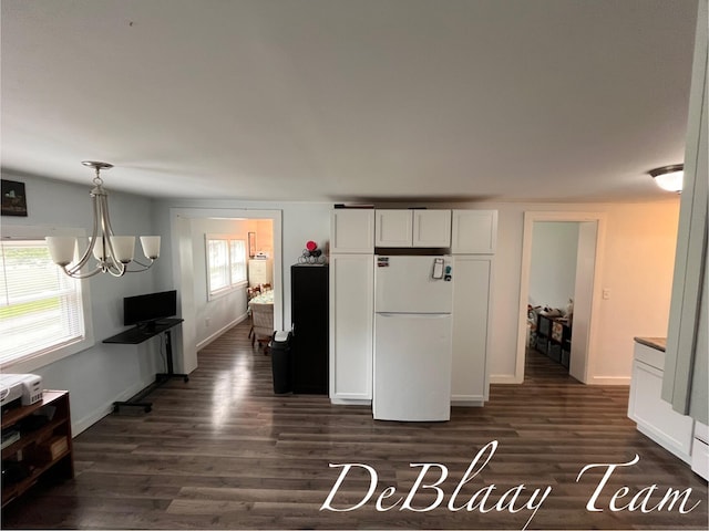 6061 Cutler Rd, Lakeview, MI 48850 - kitchen featuring freestanding refrigerator, dark wood-style flooring, a chandelier, white cabinets, and baseboards