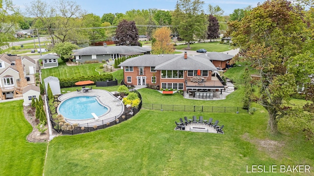 833 Allen Dr, Holland, MI 49423 - back of house featuring a fire pit, a wooden deck, and a patio