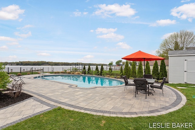 833 Allen Dr, Holland, MI 49423 - view of pool featuring a patio, fence, an outdoor structure, and a shed