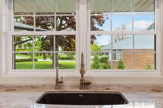 833 Allen Dr, Holland, MI 49423 - kitchen view of a sink and light stone counters