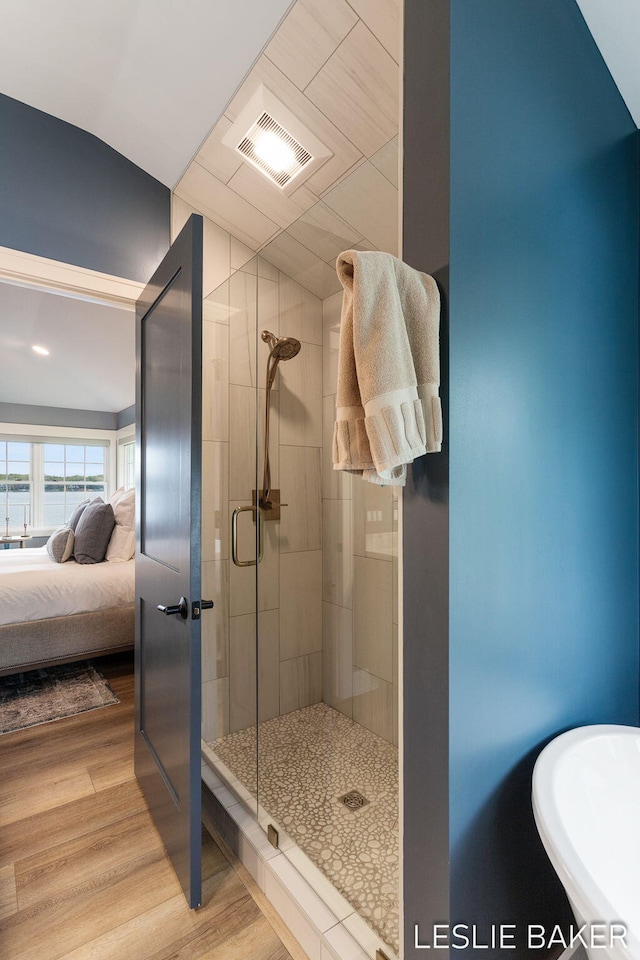 833 Allen Dr, Holland, MI 49423 - bathroom with a shower stall, ensuite bathroom, wood finished floors, and a sink