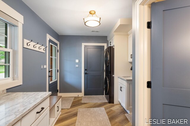 833 Allen Dr, Holland, MI 49423 - mudroom featuring light wood-style floors