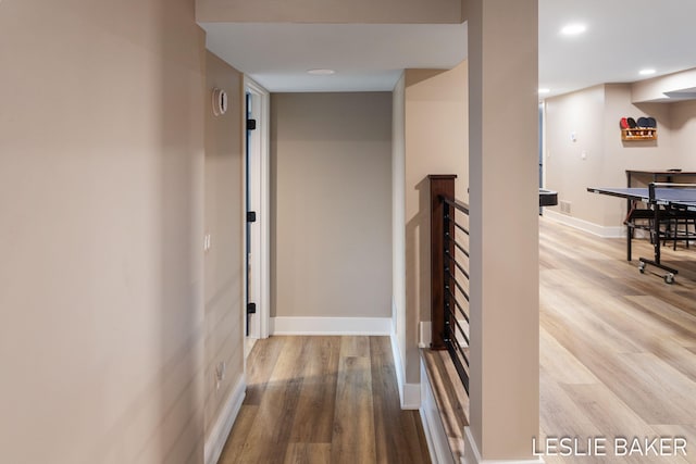833 Allen Dr, Holland, MI 49423 - hall featuring wood finished floors, recessed lighting, baseboards, and an upstairs landing