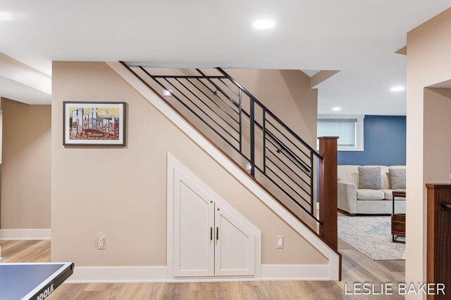 833 Allen Dr, Holland, MI 49423 - stairway featuring wood finished floors, recessed lighting, and baseboards