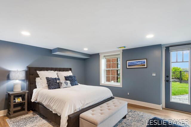 833 Allen Dr, Holland, MI 49423 - bedroom with access to exterior, light wood finished floors, baseboards, and recessed lighting