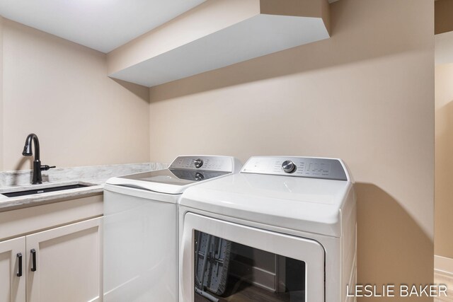 833 Allen Dr, Holland, MI 49423 - laundry room with washing machine and clothes dryer and cabinet space
