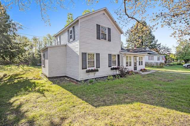 620 N Lakeshore Dr, Ludington, MI 49431 - view of side of property with a yard