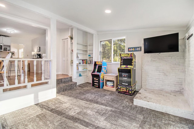 620 N Lakeshore Dr, Ludington, MI 49431 - carpeted living room with recessed lighting and brick wall