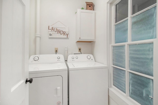 620 N Lakeshore Dr, Ludington, MI 49431 - washroom featuring independent washer and dryer and cabinet space
