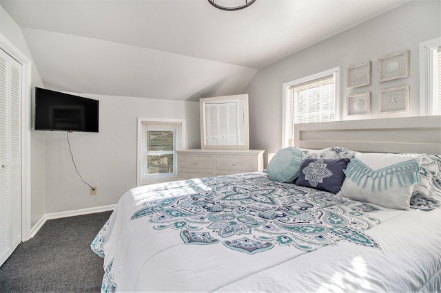 620 N Lakeshore Dr, Ludington, MI 49431 - bedroom with carpet flooring, vaulted ceiling, and baseboards