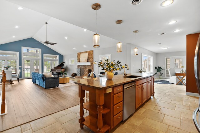 46132 86th Ave, Decatur, MI 49045 - kitchen with stainless steel dishwasher, a sink, open shelves, open floor plan, and ceiling fan