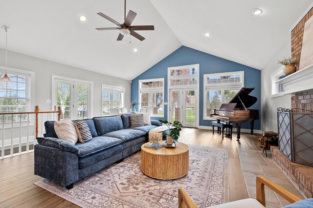 46132 86th Ave, Decatur, MI 49045 - living area featuring french doors, a ceiling fan, wood finished floors, a fireplace, and recessed lighting