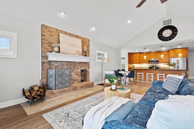 46132 86th Ave, Decatur, MI 49045 - living area with light wood finished floors, ceiling fan, a fireplace, recessed lighting, and baseboards