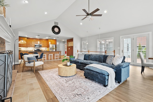 46132 86th Ave, Decatur, MI 49045 - living area featuring a ceiling fan, recessed lighting, high vaulted ceiling, and light wood-style floors