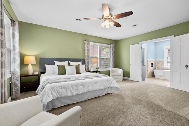 46132 86th Ave, Decatur, MI 49045 - carpeted bedroom with multiple windows, ensuite bathroom, a ceiling fan, and baseboards