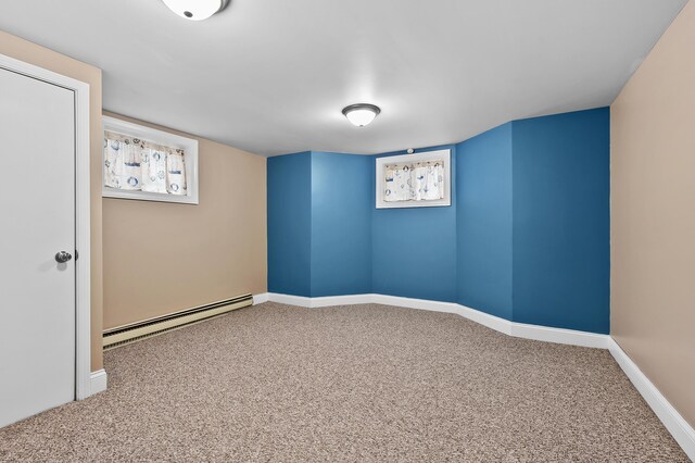 46132 86th Ave, Decatur, MI 49045 - carpeted empty room featuring a baseboard radiator, baseboards, and healthy amount of natural light