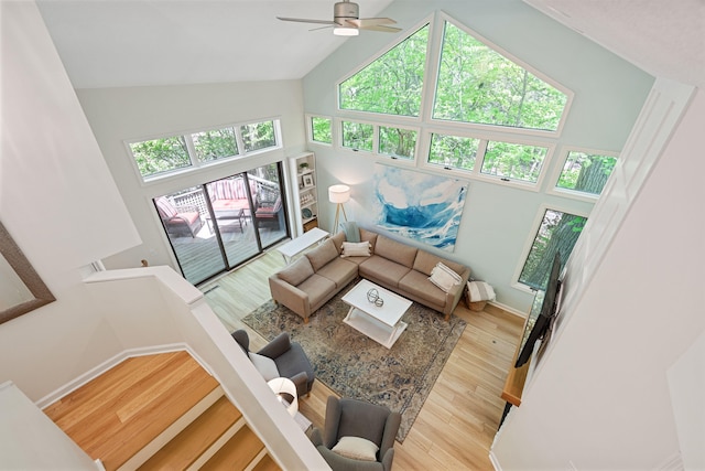 9773 Weko Dr, Bridgman, MI 49106 - living area with healthy amount of natural light, ceiling fan, wood finished floors, and high vaulted ceiling