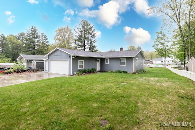 8220 Indian Shores Dr, Howard City, MI 49329 - ranch-style home featuring a garage, concrete driveway, and a chimney