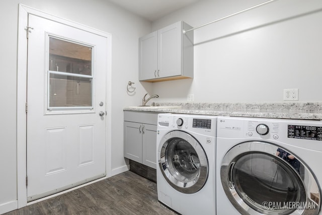 8220 Indian Shores Dr, Howard City, MI 49329 - laundry room with separate washer and dryer, cabinet space, dark wood-type flooring, and baseboards