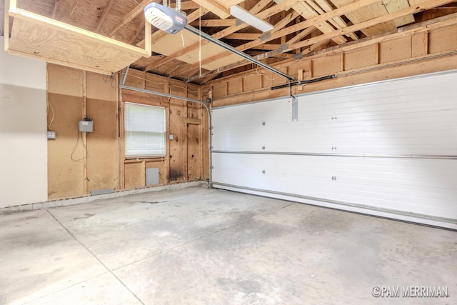 8220 Indian Shores Dr, Howard City, MI 49329 - garage featuring a garage door opener