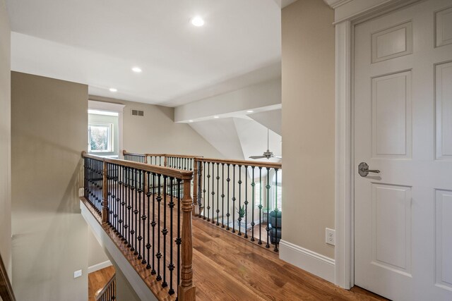 4624 Parman Rd, Stockbridge, MI 49285 - hallway with wood finished floors, recessed lighting, baseboards, an upstairs landing, and lofted ceiling