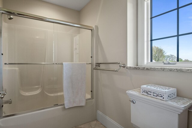 4624 Parman Rd, Stockbridge, MI 49285 - bathroom featuring enclosed tub / shower combo, baseboards, and toilet