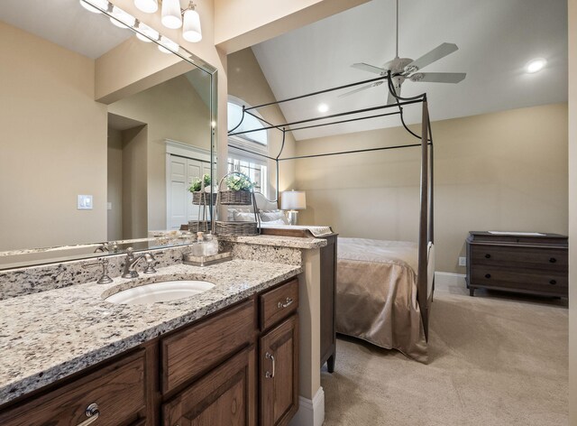 4624 Parman Rd, Stockbridge, MI 49285 - bathroom featuring vaulted ceiling, ceiling fan, vanity, and ensuite bathroom