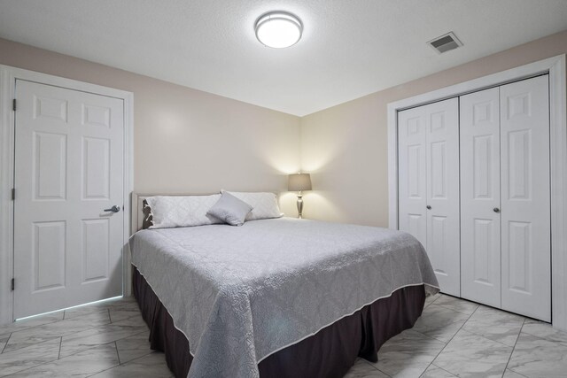 4624 Parman Rd, Stockbridge, MI 49285 - bedroom with light marble finish flooring and a closet