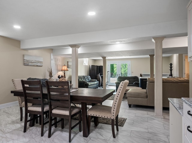 4624 Parman Rd, Stockbridge, MI 49285 - dining area featuring light marble finish flooring, decorative columns, recessed lighting, and baseboards