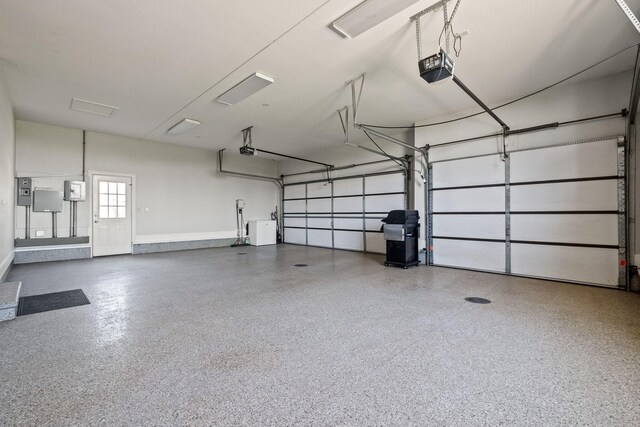 4624 Parman Rd, Stockbridge, MI 49285 - garage featuring a garage door opener