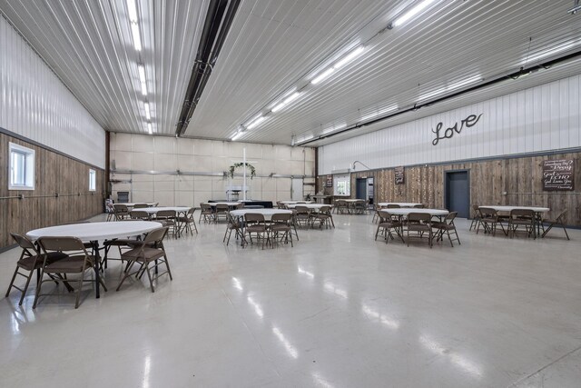 4624 Parman Rd, Stockbridge, MI 49285 - miscellaneous room with concrete floors and wood walls
