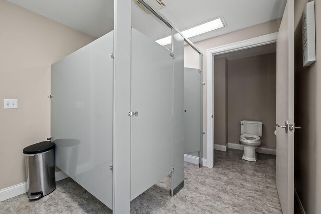 4624 Parman Rd, Stockbridge, MI 49285 - full bathroom with toilet, a shower, and baseboards